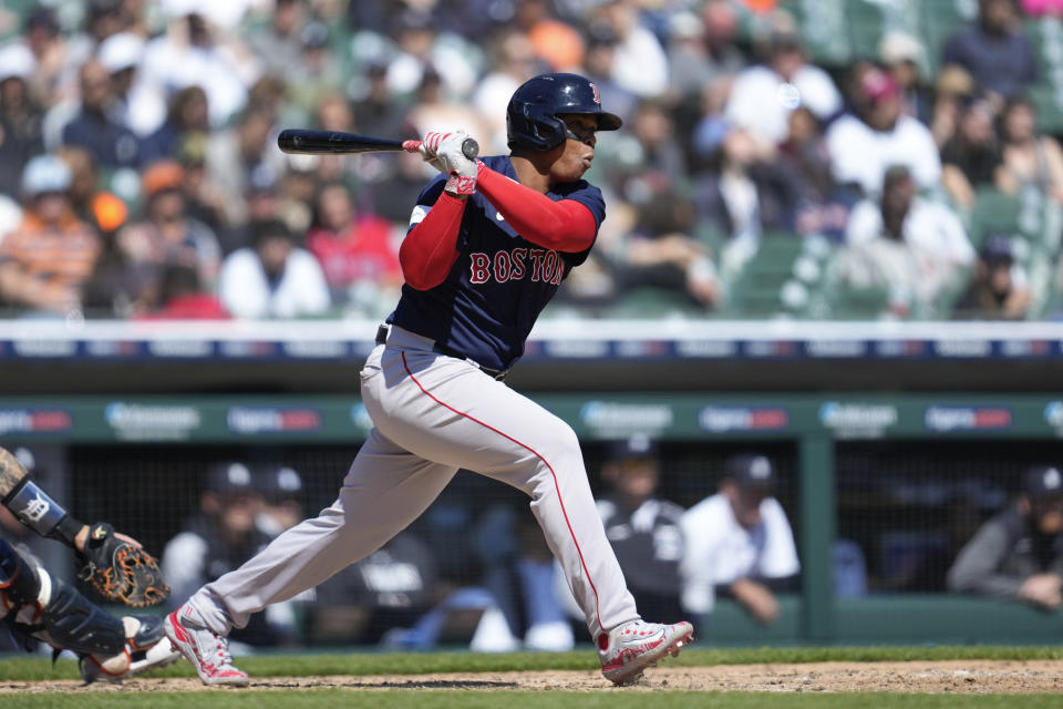 Boston Red Sox's Rafael Devers singles against the Detroit Tigers in the seventh inning of a baseball game in Detroit, Sunday, April 9, 2023. (AP Photo/Paul Sancya)