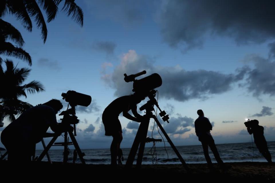 Telescopic cameras and computer equipment are set up on Palm Cove beach in preparation to run a live stream via NASA of the total solar eclipse on November 13, 2012 in Cairns, Australia.