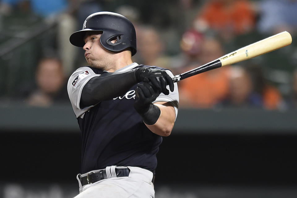 New York Yankees' Luke Voit singles against the Baltimore Orioles during the seventh inning of a baseball game, Sunday, Aug. 26, 2018, in Baltimore. The Yankees won 5-3. (AP Photo/Gail Burton)