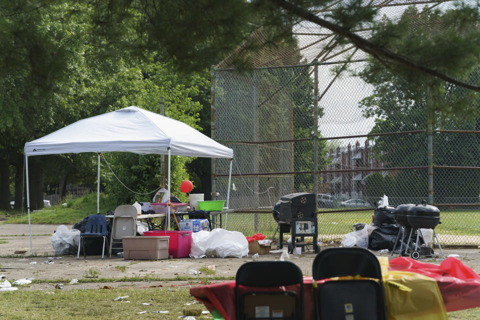 The scene of a graduation party Monday, June 17, 2019 where a gunman opened fire Sunday evening, at Paschall Playground in Southwest Philadelphia. (Jessica Griffin/The Philadelphia Inquirer via AP )