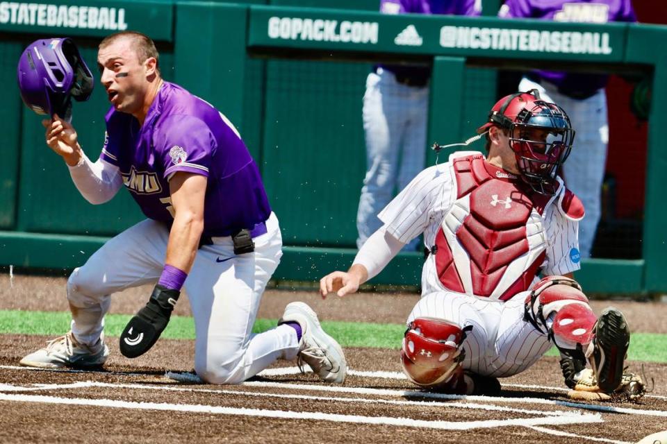 South Carolina’s Cole Messina tags out James Madison’s Brendan O’Donnell at home plate Friday in their NCAA Tournament game at Doak Field at Dail Park in Raleigh, N.C.