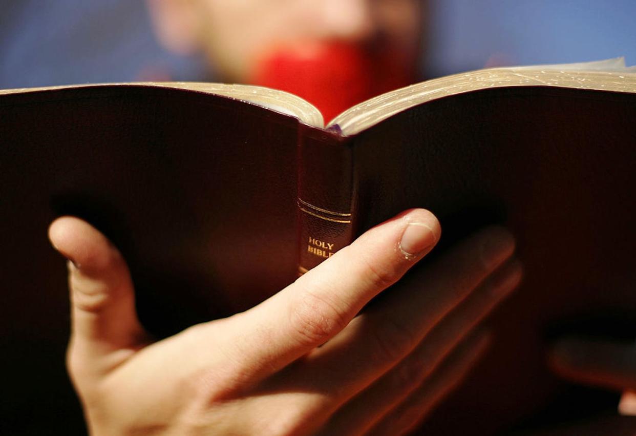 Activist Jason Hershey reads from a Bible as he protests in front of the U.S. Supreme Court with the anti-abortion group Bound for Life in 2005 in Washington, D.C. <a href="https://www.gettyimages.com/detail/news-photo/pro-life-activist-jason-hershey-reads-from-a-bible-as-he-news-photo/56303642?adppopup=true" rel="nofollow noopener" target="_blank" data-ylk="slk:Win McNamee via Getty Images;elm:context_link;itc:0;sec:content-canvas" class="link ">Win McNamee via Getty Images</a>