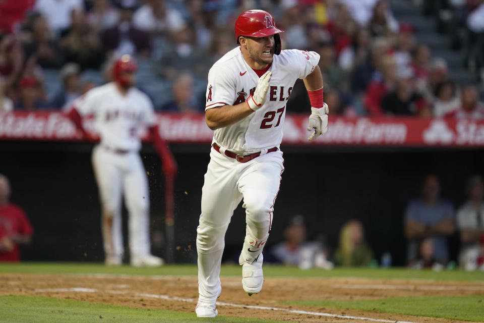 Los Angeles Angels' Mike Trout (27) runs to first while doubling during the third inning of a baseball game against the Boston Red Sox in Anaheim, Calif., Tuesday, June 7, 2022. (AP Photo/Ashley Landis)