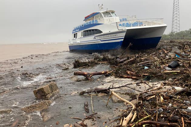 A boat lies washed up on shore Monday in Ponce, Puerto Rico. (Photo: Ricardo Ortiz/Reuters TV via Reuters)