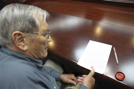 U.S. citizen Merrill E. Newman puts his thumbprint on a piece of paper, after being taken into custody by North Korea, after entering North Korea as a tourist, at an undisclosed location in this undated photo released by North Korea's Korean Central News Agency (KCNA) in Pyongyang on November 30, 2013. North Korea said on Saturday it had arrested Newman for "hostile acts" against the state and accused him of being "a criminal" who was involved in the killing of civilians during the 1950-53 Korean War. REUTERS/KCNA