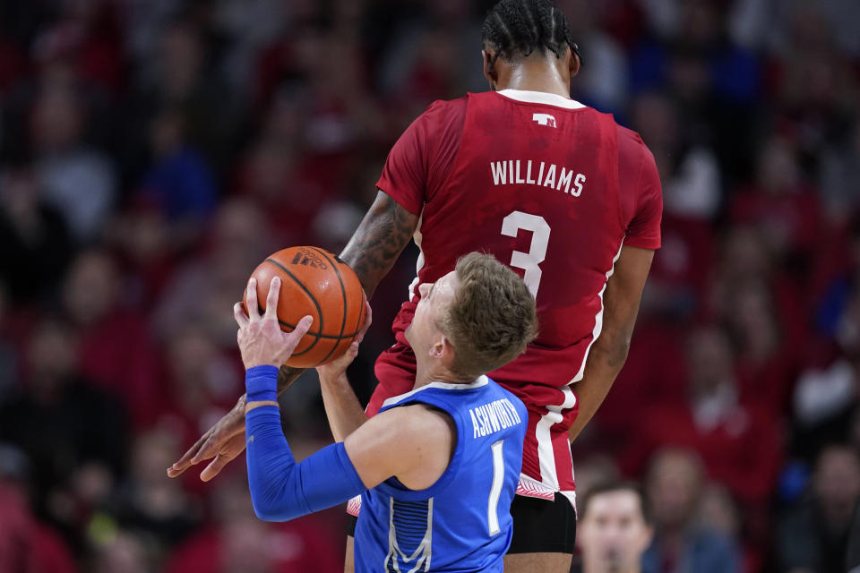 Creighton guard Steven Ashworth (1) is fouled by Nebraska guard Brice Williams (3) while shooting a 3-point basket during the first half of an NCAA college basketball game, Sunday, Dec. 3, 2023, in Lincoln, Neb. (AP Photo/Charlie Neibergall)