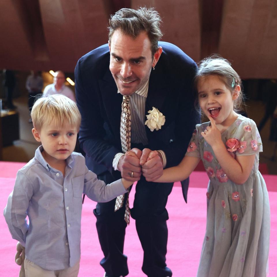 Oscar Humphries arrives with his children for the State Memorial service for Australian comedian Barry Humphries at the Sydney Opera House