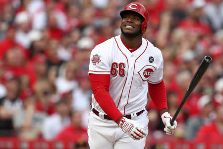 FILE PHOTO: Cincinnati Reds right fielder Yasiel Puig (66) reacts to hitting a fly ball for an out against the Pittsburgh Pirates in the sixth inning at Great American Ball Park. Mandatory Credit: Aaron Doster-USA TODAY Sports