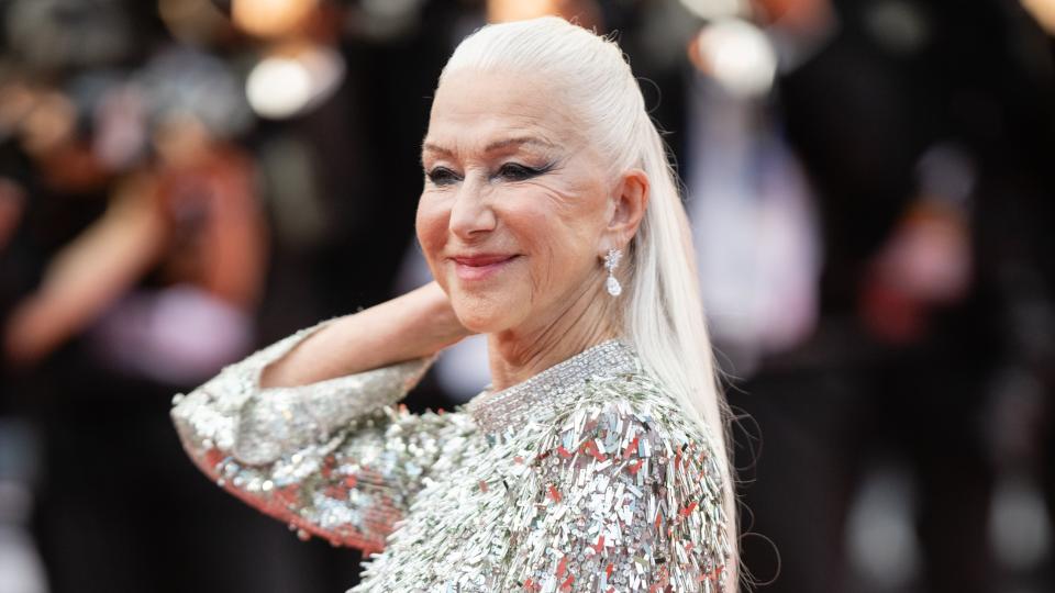 Helen Mirren is pictured with waist-length, platinum blonde hair as she attends the screening of 