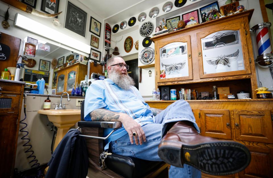 Court Ketron, owner of Barbershop Deluxe at 1206 E. Elm St., talks about his plans for the barber shop and the history of the shop on Tuesday, Nov. 28, 2023.