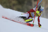 Austria's Manuel Feller speeds down the course during the men's World Championship slalom, in Courchevel, France, Sunday Feb. 19, 2023. (AP Photo/Alessandro Trovati)
