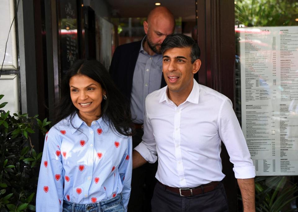 Rishi Sunak with his wife Akshata Murty at a general election campaign event (Chris J Ratcliffe)