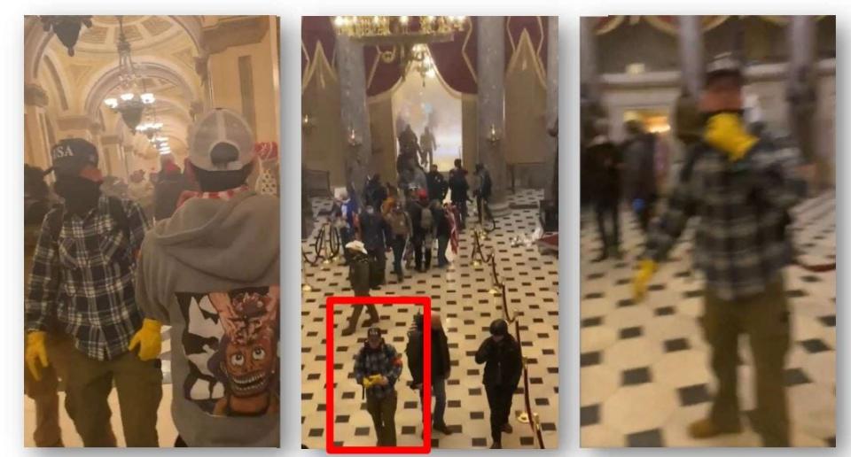 A federal complaint alleges that Micajah Joel Jackson (blue flannel shirt, yellow gloves and baseball hat) walked through various areas of the U.S. Capitol building, including the hallway leading to the National Statuary Hall and the National Statuary Hall on Jan. 6, 2021, the day of the Capitol riot.