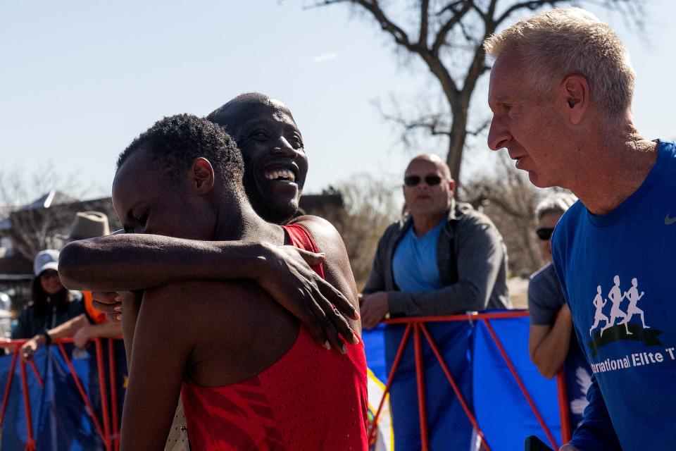 David Bett embraces his wife, Betty Sigei, after the pair won the overall and women's titles, respectively, during the Horsetooth Half Marathon on Sunday in Fort Collins.