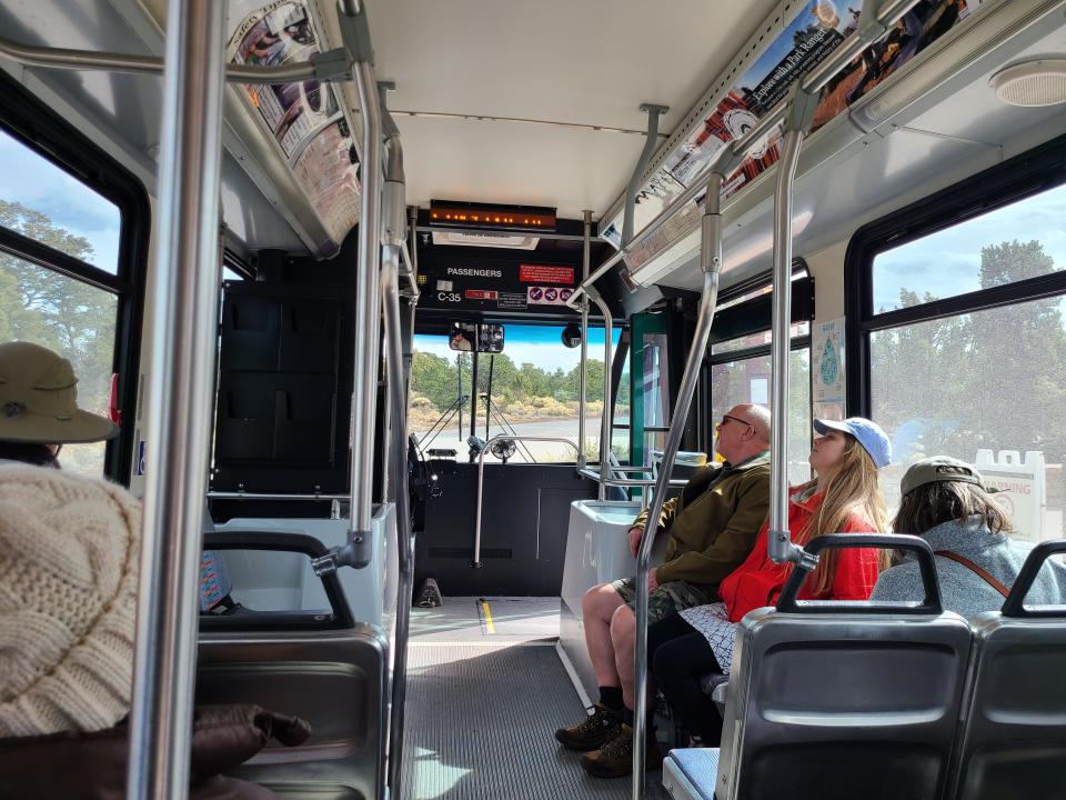 Shuttle bus with a few people on it to see Grand Canyon in winter