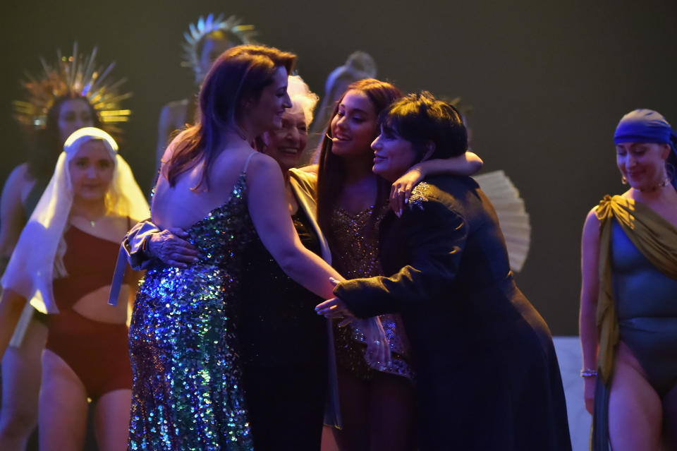 The four hug each other at the end of the performance.&nbsp; (Photo: Kevin Mazur via Getty Images)