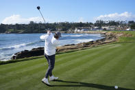New York Jets quarterback Aaron Rodgers hits from the 18th tee at Pebble Beach Golf Links during the second round of the AT&T Pebble Beach National Pro-Am golf tournament in Pebble Beach, Calif., Friday, Feb. 2, 2024. (AP Photo/Eric Risberg)