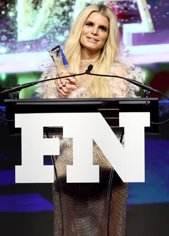 <p>Jamie McCarthy/Footwear News via Getty</p> Jessica Simpson accepts the Icon Award at the 2023 Footwear News Achievement Awards in New York City