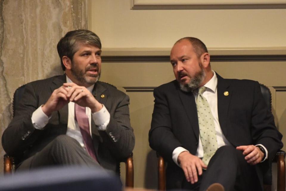 Two men in suits talking