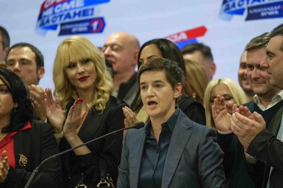 Serbian Prime Minister and Serbian Progressive Party vice president Ana Brnabic, center, speaks to the media in her party headquarters after a parliamentary and local election in Belgrade, Serbia, Sunday, Dec. 17, 2023. Serbia’s governing populists claimed a sweeping victory Sunday in the country's parliamentary election, which was marred by reports of major irregularities both during a tense campaign and on voting day. (AP Photo/Darko Vojinovic)