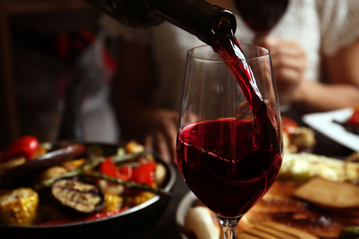 Burgundy wine in a glass at a dinner table