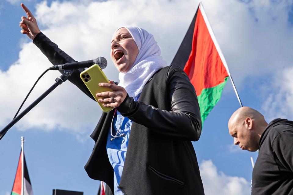 Dr. Afnan Albahri decries the murder of children in Gaza during a Rally in Support of Palestine that culminated with a march along Barley Mill Road to President Joe Biden's home in Greenville on Saturday, Nov. 11, 2023. More than 1,500 people attended the rally and march.