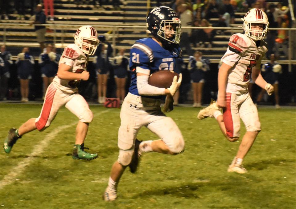 Whitesboro Warrior Tyler Thorngren (21) cuts thrugh the Fulton defense on a 45-yard catch and run for a touchdown during the second half of Friday's Section III playoff game at Chiz Frye Field.