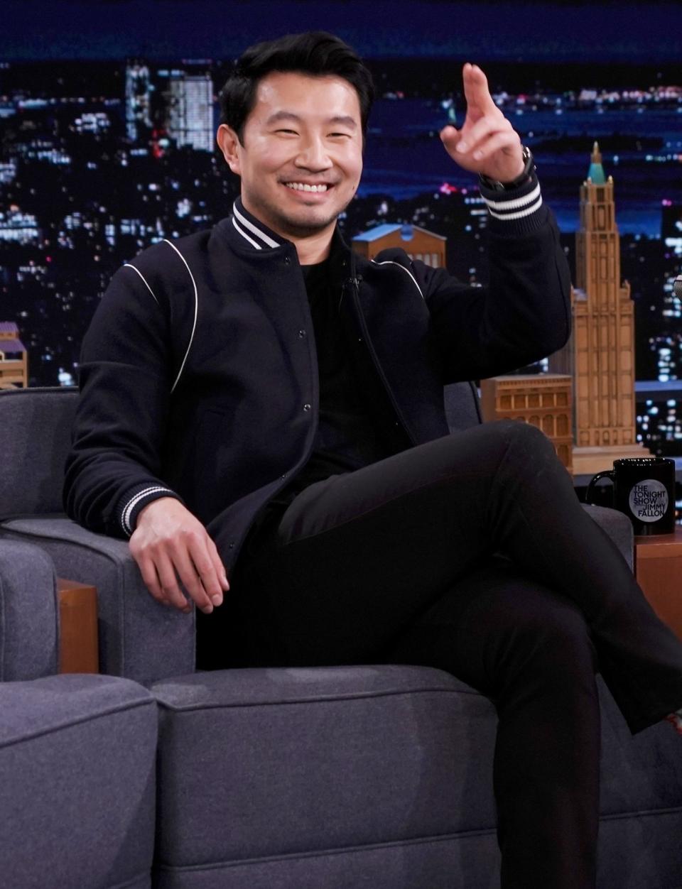 <p>Simu Liu greets the audience during an interview with Jimmy Fallon on <em>The Tonight Show Starring Jimmy Fallon </em>in N.Y.C. on Nov. 18. </p>