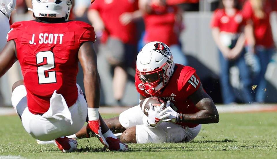 N.C. State defensive back Devan Boykin (12) intercepts the ball during the first half of N.C. State’s game against Clemson at Carter-Finley Stadium in Raleigh, N.C., Saturday, Oct. 28, 2023.