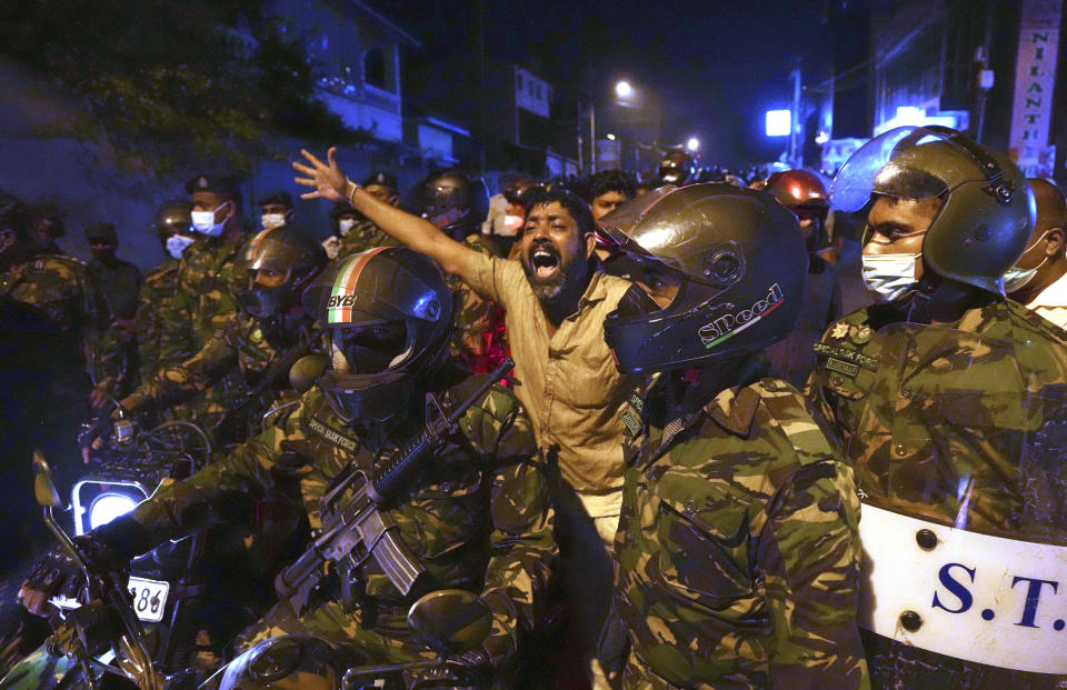 FILE - A man shouts anti-government slogans during a protest outside the president's private residence on the outskirts of Colombo, Sri Lanka, Thursday, March 31, 2022. Some 1.6 billion people in 94 countries face at least one dimension of the crisis in food, energy and financial systems, according to a report last month by the Global Crisis Response Group of the United Nations Secretary-General. (AP Photo/Eranga Jayawardena, File)