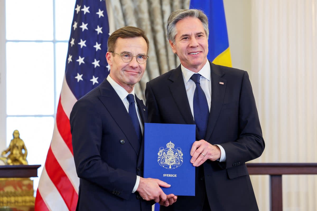 US Secretary of State Antony Blinken, right, accepts Sweden’s instruments of accession from Swedish Prime Minister Ulf Kristersson (Reuters)