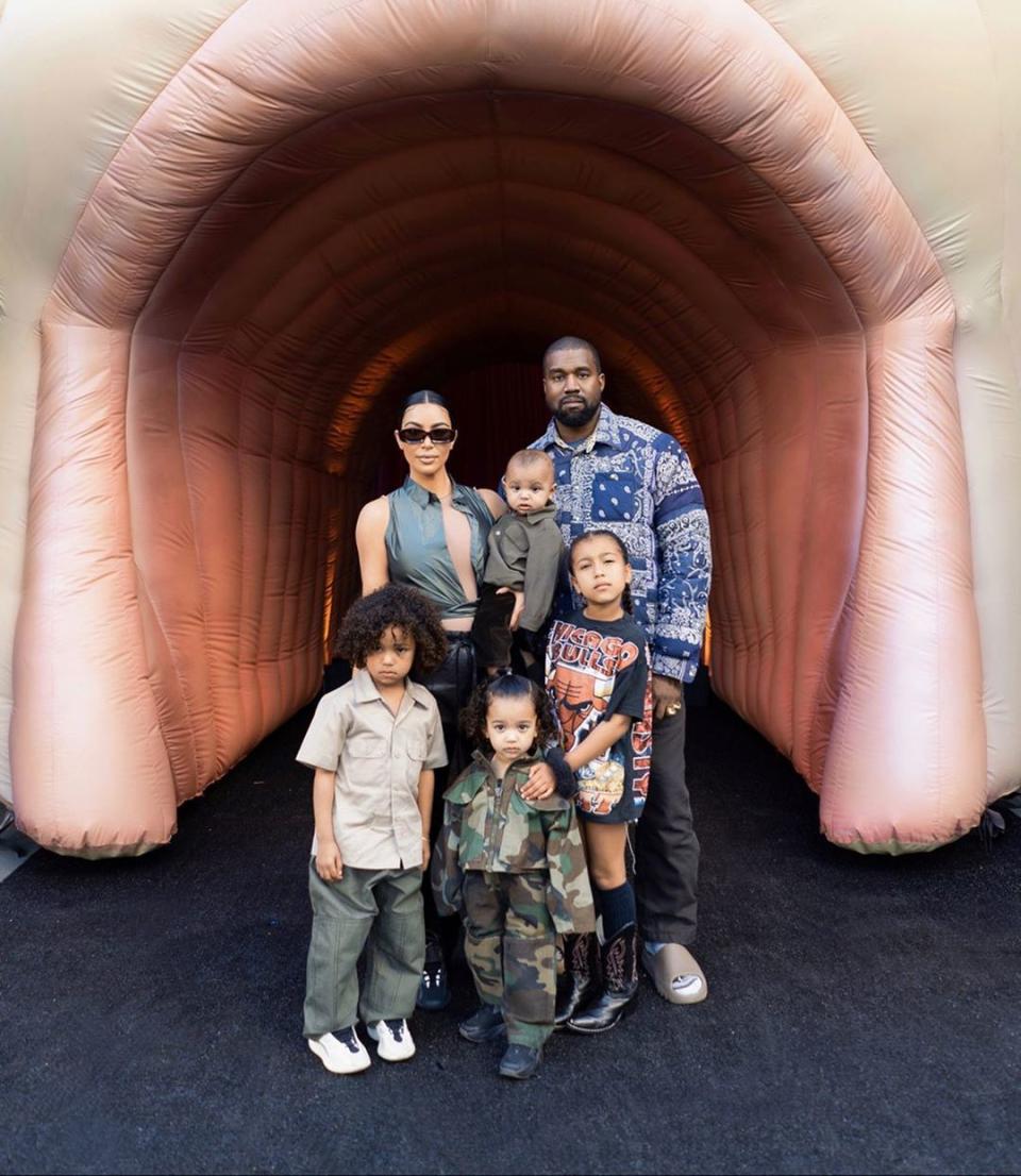 Kim Kardashian and Kanye West pose with their four children