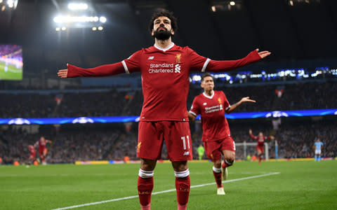 Mohamed Salah of Liverpool celebrates after scoring his sides first goal during the UEFA Champions League Quarter Final Second Leg match between Manchester City and Liverpool at Etihad Stadium on April 10, 2018 in Manchester, England - Credit: Getty Images