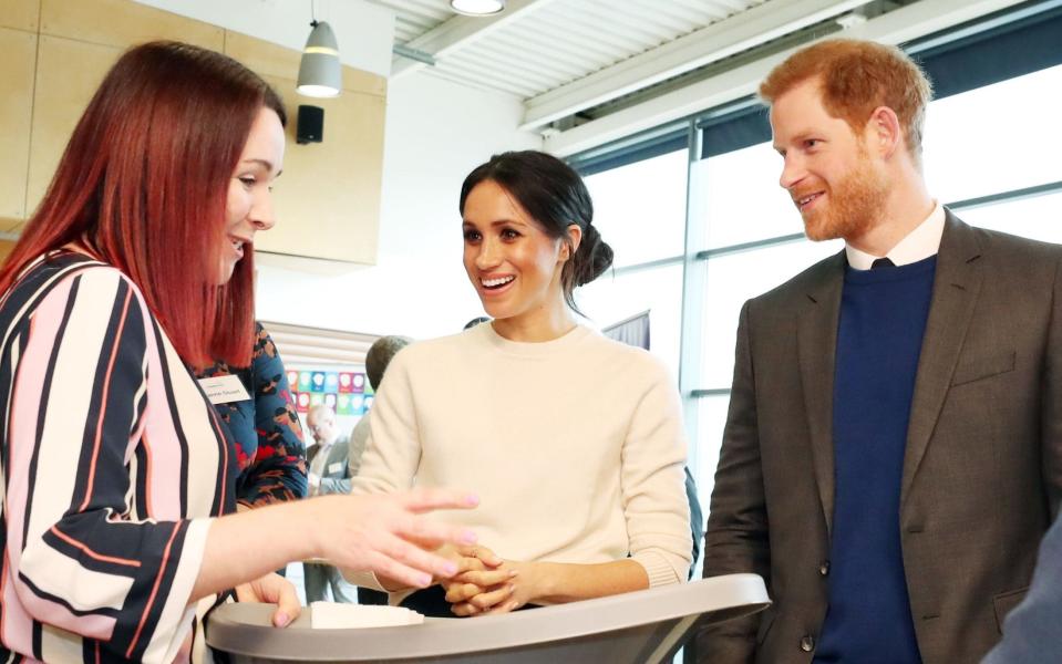 Meghan and Harry inspect baby products with Sinead Murphy of Shnuggle during a trip to Belfast  - PA