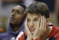 Atlanta Hawks' Kyle Korver watches from the bench late during the second half in Game 2 of an opening-round NBA basketball playoff series against the Indiana Pacers Tuesday, April 22, 2014, in Indianapolis. Indiana defeated Atlanta 101-85. (AP Photo/Darron Cummings)