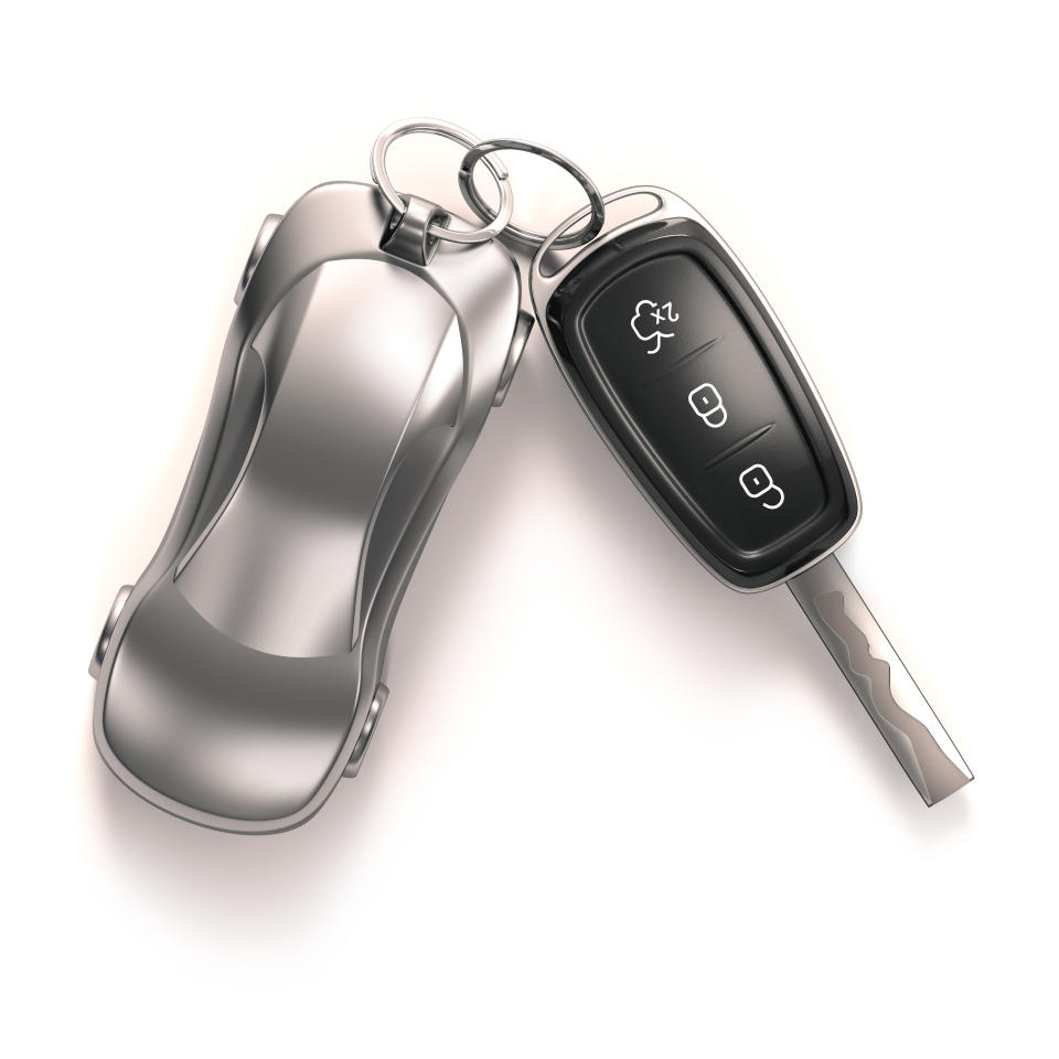 Car key and key ring, studio shot.