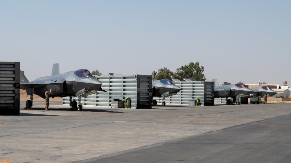 US aircraft lined up on tarmac.