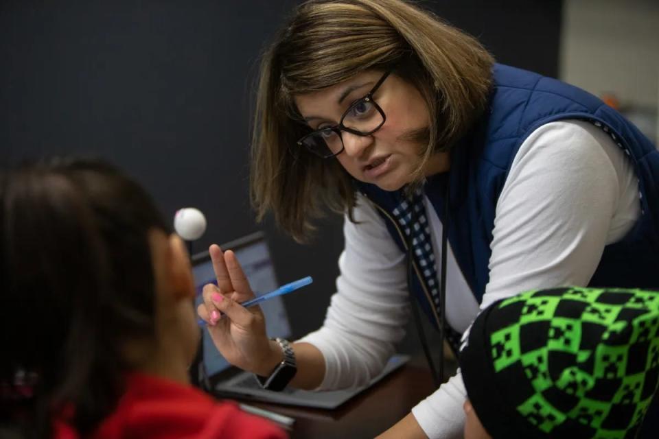 Myrna Lopez-Patty, principal of Tornillo ISD’s PreK-8th campus, explains state laws on school attendance during a personal meeting with the mother of a student who had accumulated tardies and absences.