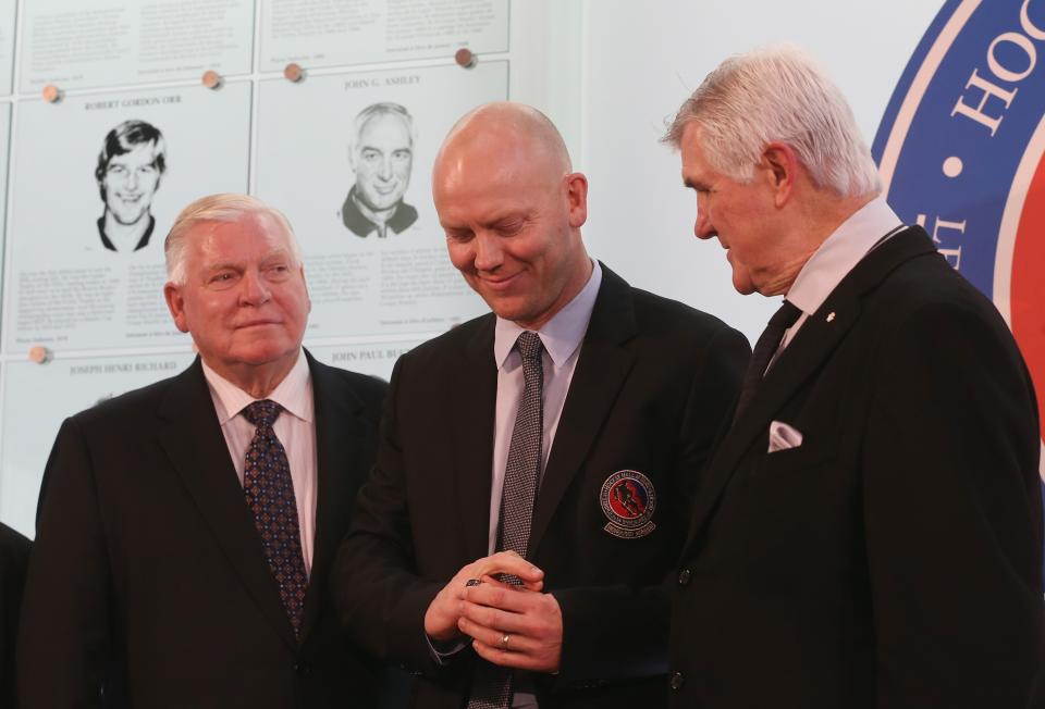 TORONTO, ON - NOVEMBER 12: Bill Hay (L) and Pat Quinn (R) give Mats Sundin his Hockey Hall of Fame ring in a ceremony at the Hall on November 12, 2012 in Toronto, Canada. Sundin and three other former NHL players will be inducted into the Hall during a ceremony later today. (Photo by Bruce Bennett/Getty Images)