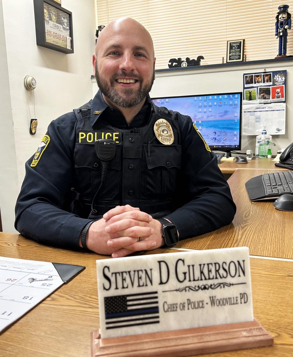 Woodville Police Chief Steve Gilkerson sits at his new desk at the village police station.