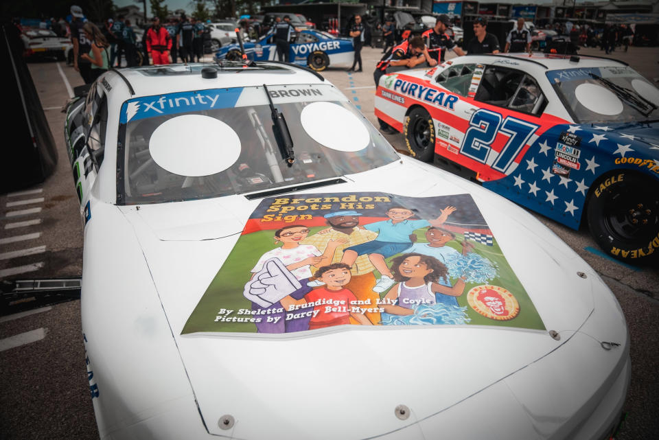 This photo provided by LakeSide Media shows the hood of NASCAR driver Brandon Brown’s Camaro featuring the cover design for “Brandon Spots His Sign,” a children’s book written by Sheletta Brundidge in honor of her son, Brandon Brundidge. Brown drove this Camaro at his Xfinity Series race Saturday at Road America in Elkhart Lake, Wis. (Garrett Pace/LakeSide Media)