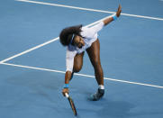 File-This Dec. 7, 2015, file photo shows USA's Serena Williams tripping as she returns a shot to Croatia's Mirjana Lucic-Baroni of Japan Warriors in the women's singles match of the 2015 International Premier Tennis League at suburban Pasay city south of Manila, Philippines. Williams has been voted the AP Female Athlete of the Decade for 2010 to 2019. Williams won 12 of her professional-era record 23 Grand Slam singles titles over the past 10 years. No other woman won more than three in that span. She also tied a record for most consecutive weeks ranked No. 1 and collected a tour-leading 37 titles in all during the decade. Gymnast Simone Biles finished second in the vote by AP member sports editors and AP beat writers. Swimmer Katie Ledecky was third, followed by ski racers Lindsey Vonn and Mikaela Shiffrin. (AP Photo/Bullit Marquez, File)