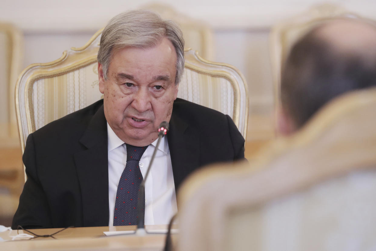 FILE - U.N. Secretary-General Antonio Guterres, left, and Russian Foreign Minister Sergey Lavrov, back to the camera, talk during their meeting in Moscow, Russia, April 26, 2022. Russian, French and American leaders are crisscrossing Africa to win support for their positions on the war in Ukraine in July 2022, an intense competition for influence the continent has not seen since the Cold War. (Maxim Shipenkov/Pool Photo via AP, File)