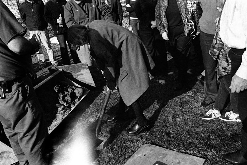 Friends and family, as a symbolic gesture to bid their farewells, shovel dirt over the ashes of U.S. Soldier Specialist Dirk Terpstra, 26, who, after serving a 12-month tour in Afghanistan in 2009, committed suicide near his home in Michigan. March 8, 2010.