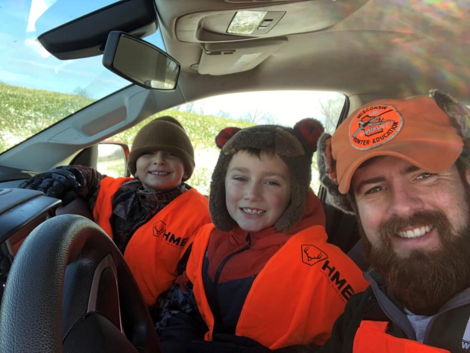 From left, Paxton Wood, 6, and Roman Wood, 8, with their uncle, Brian Reisinger, coming back from deer hunting in November of 2022.