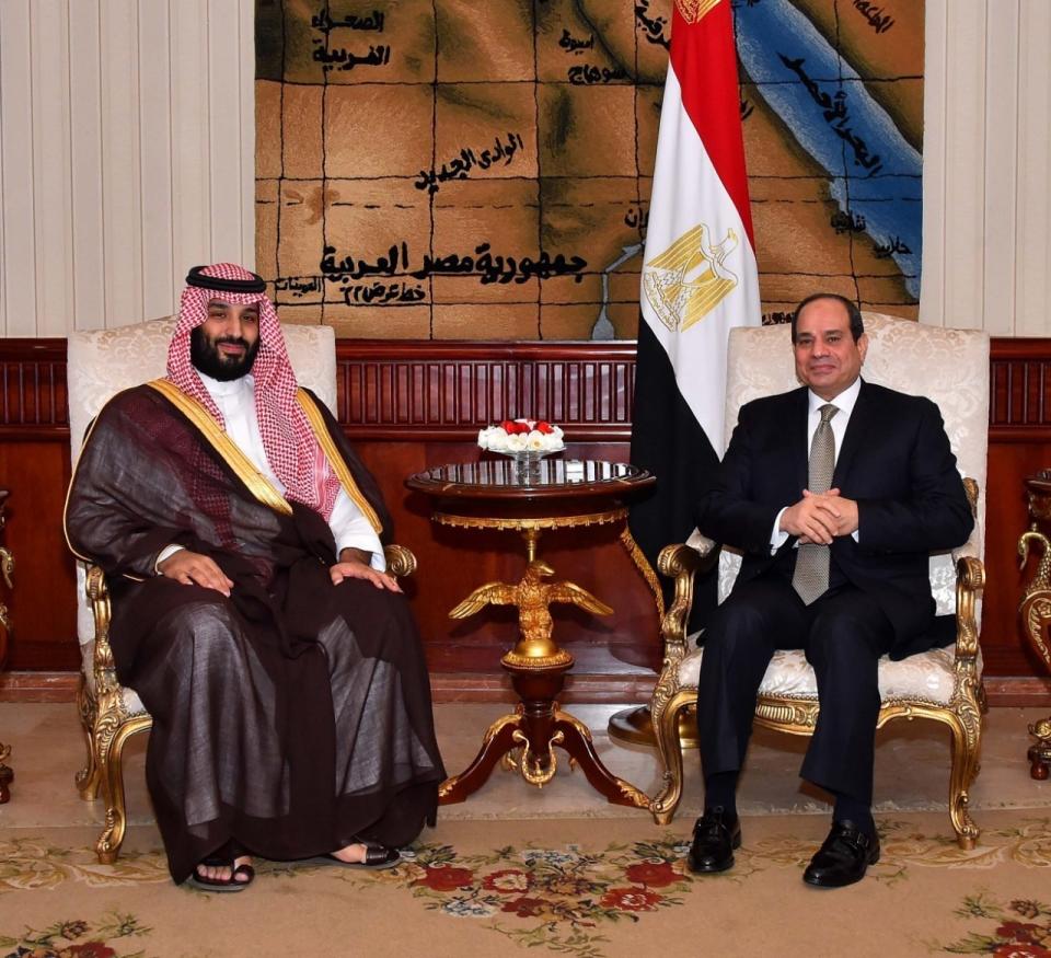 In this Monday, Nov. 26, 2018, photo released by the Egyptian Presidency's office, Saudi Arabia's Crown Prince Mohammed bin Salman poses with Egyptian President Abdel-Fattah El-Sissi in Cairo. (Egyptian Presidency via AP)