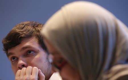 Students pursuing a diploma in "Multiculturalism, Secularism and Religion" listen to Professor Philippe Gaudin in classroom at the Catholic University of Paris (ICP) March 13, 2015. REUTERS/Christian Hartmann