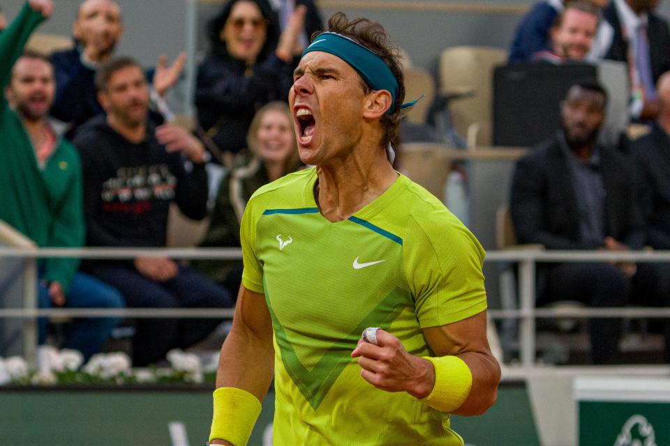 Rafa Nadal (pictured) fist-pumps after winning a point against Felix Auger-Aliassime.