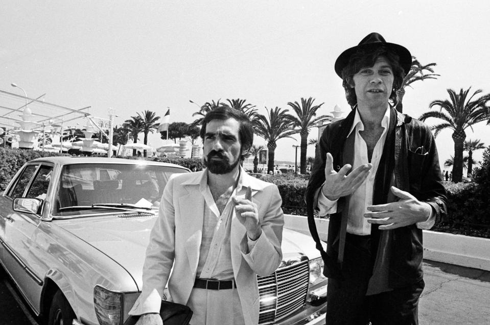 FILE - In this May 29, 1978 file photo, Robbie Robertson, right, a Canadian guitarist of Mohawk ancestry, stands next to American director Martin Scorsese, left, before they presented the film "Last Waltz," a film about Robertson's band, at the 31st Cannes International Film Festival. "RUMBLE: The Indians Who Rocked the World," a new PBS Independent Lens documentary set to air Monday, Jan 21, 2019, shows how Native Americans laid the foundations to rock, blues and jazz. (AP Photo, File)