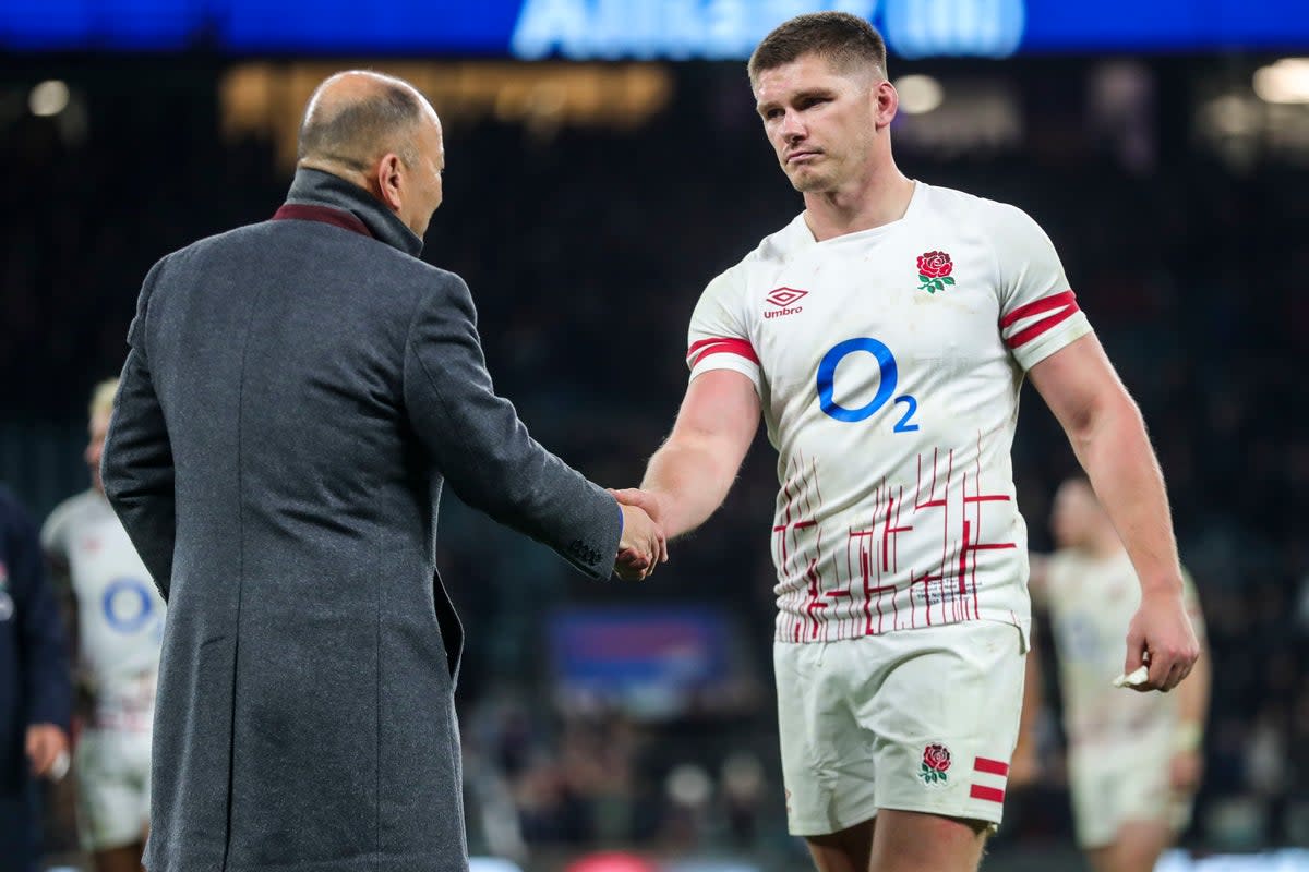 Eddie Jones shakes hands with Owen Farrell at full-time against New Zealand  (PA)